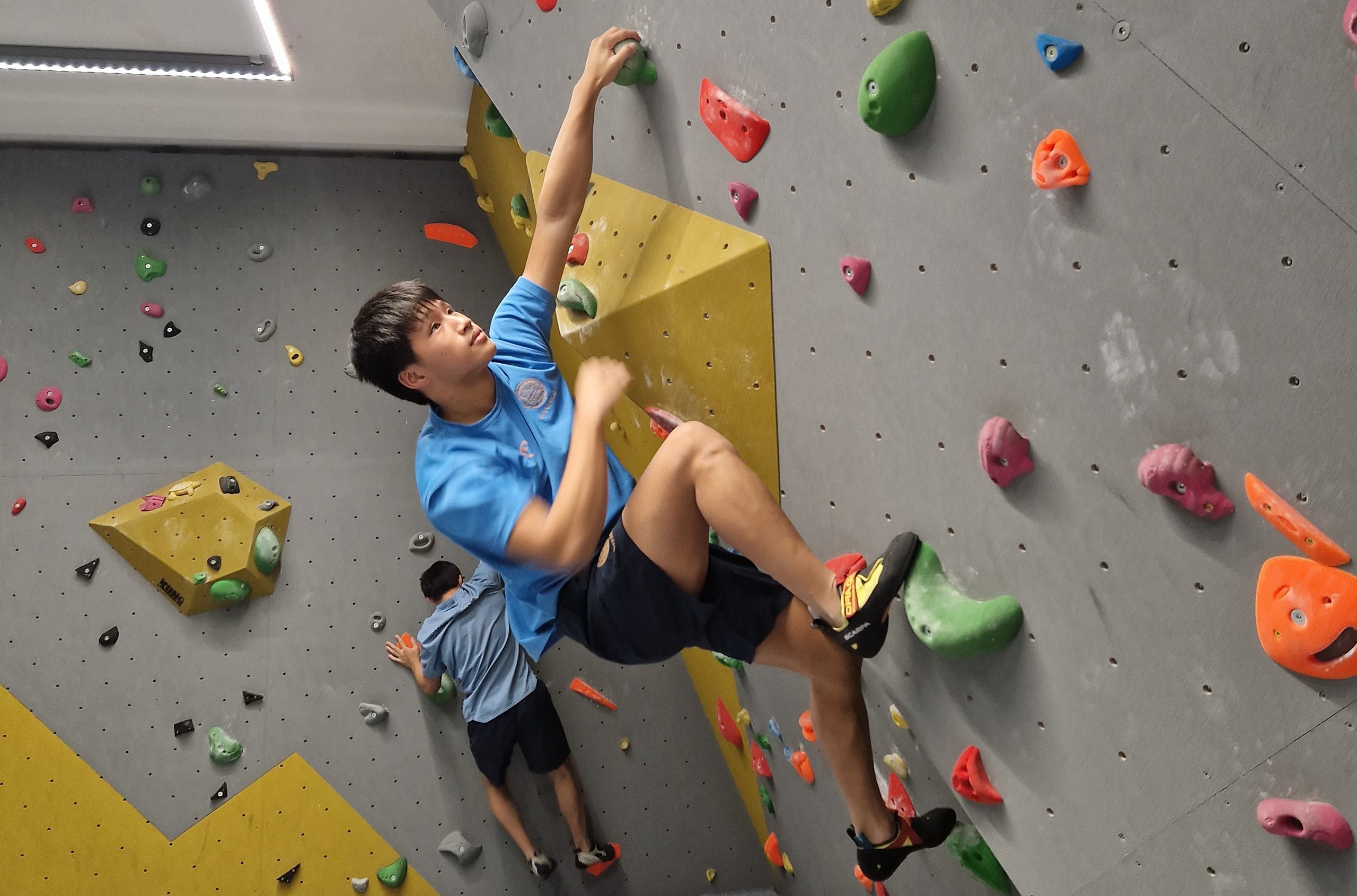 Student Doing Rock Climbing