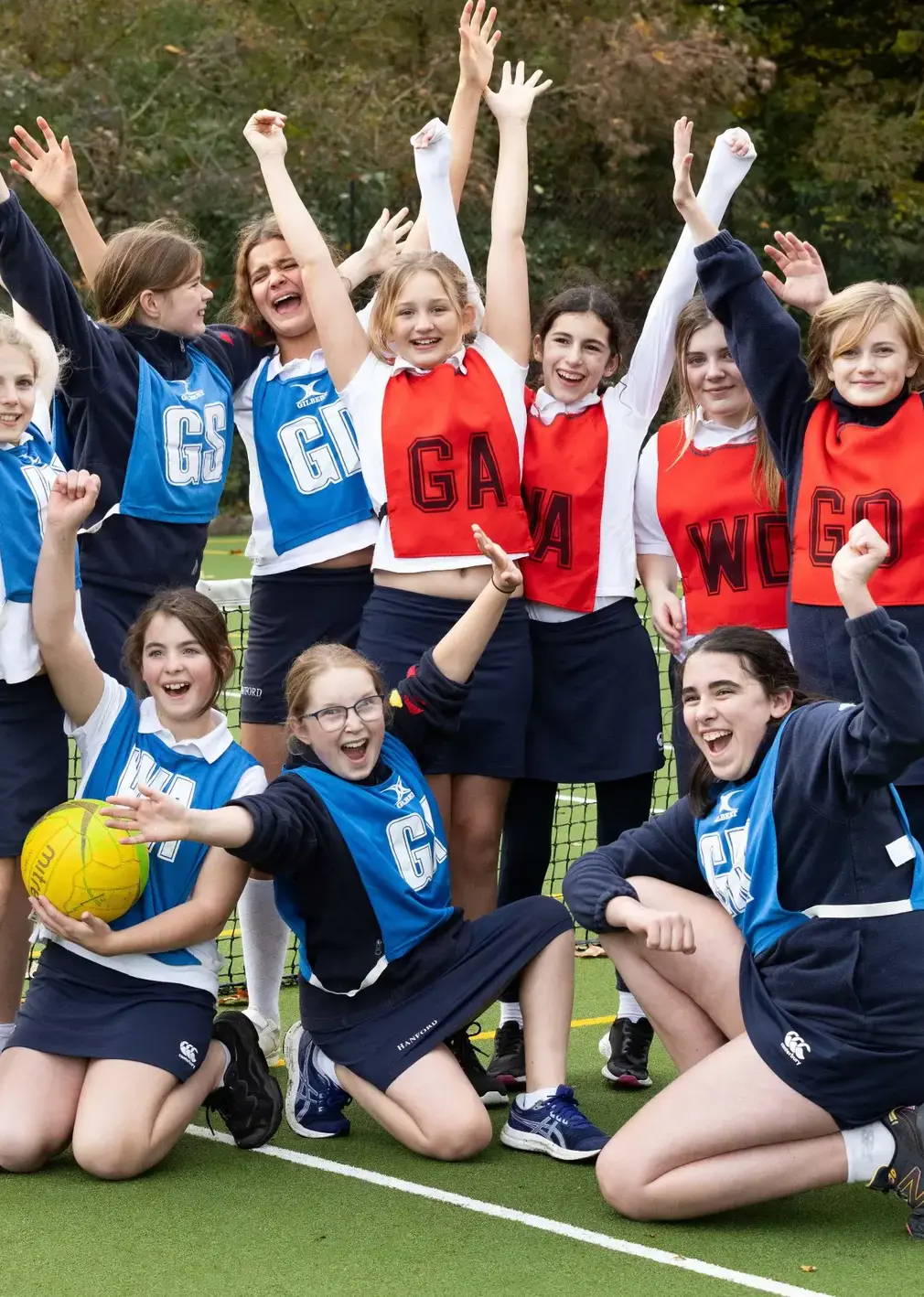 Students throwing hands in air