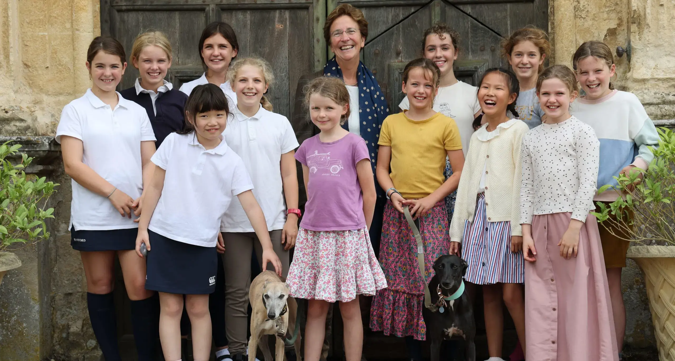 Group of Happy Girls With Headmistress