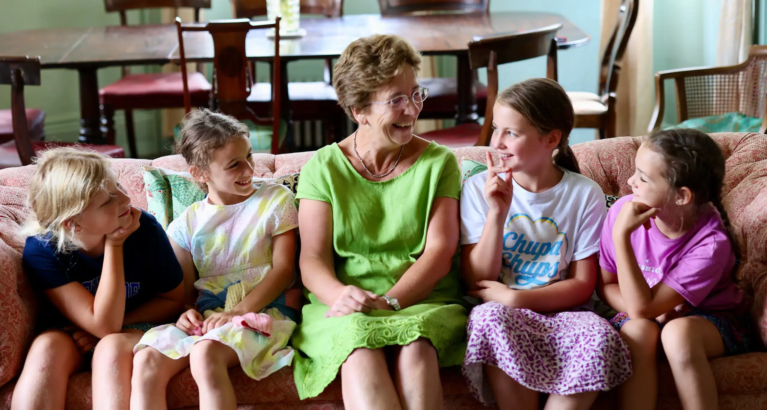 Hillary and Students Chatting on Sofa