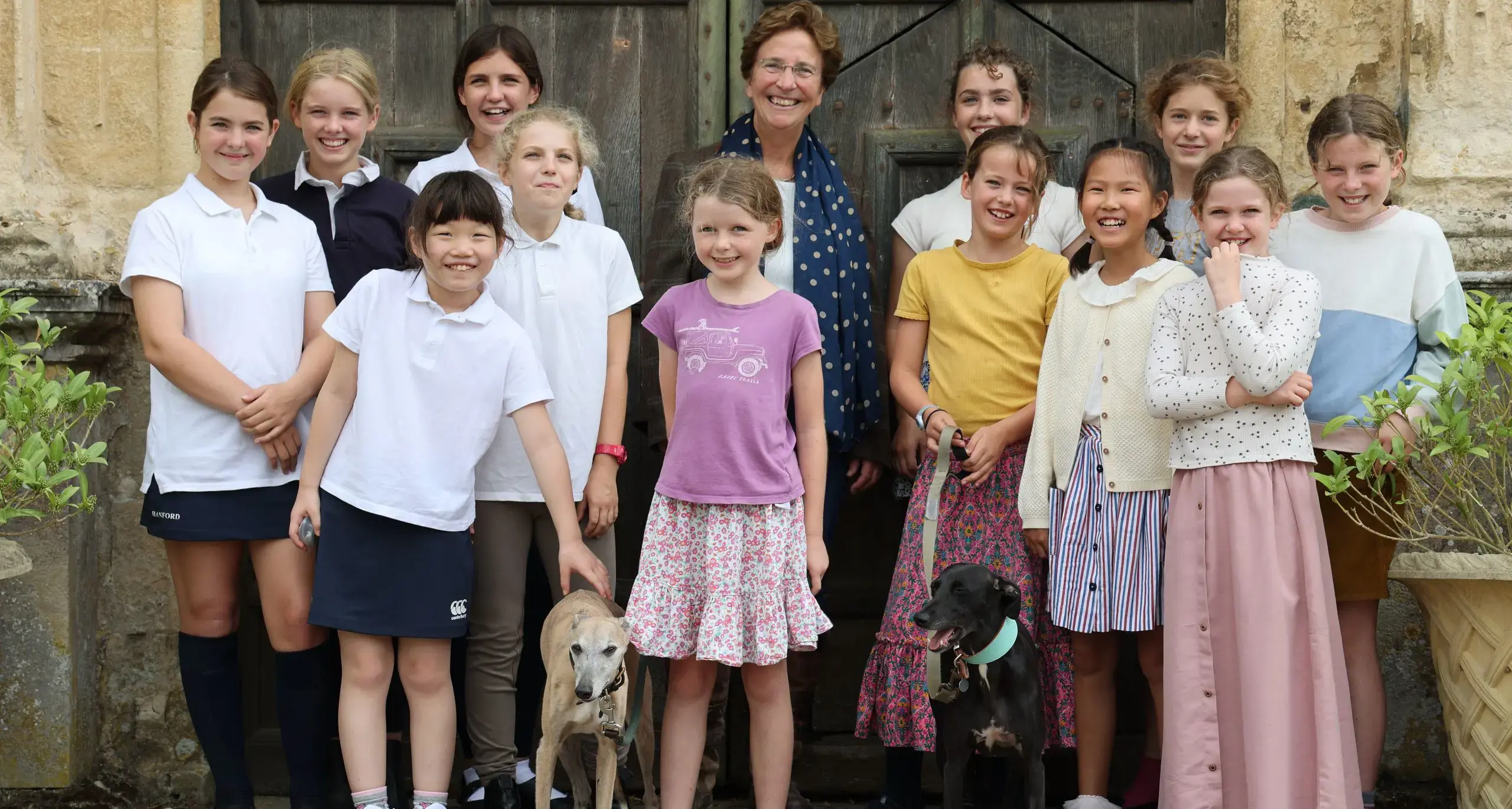 Students and Head, Hilary Philips, Posing with Dogs
