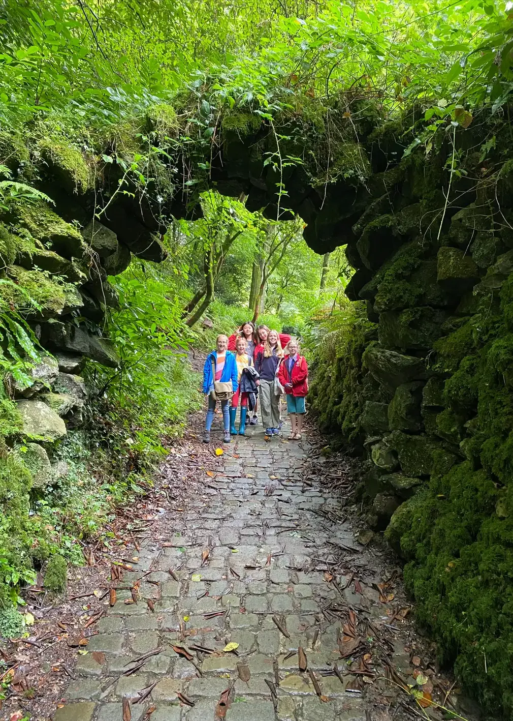 Students Walking Through Campus Gardens