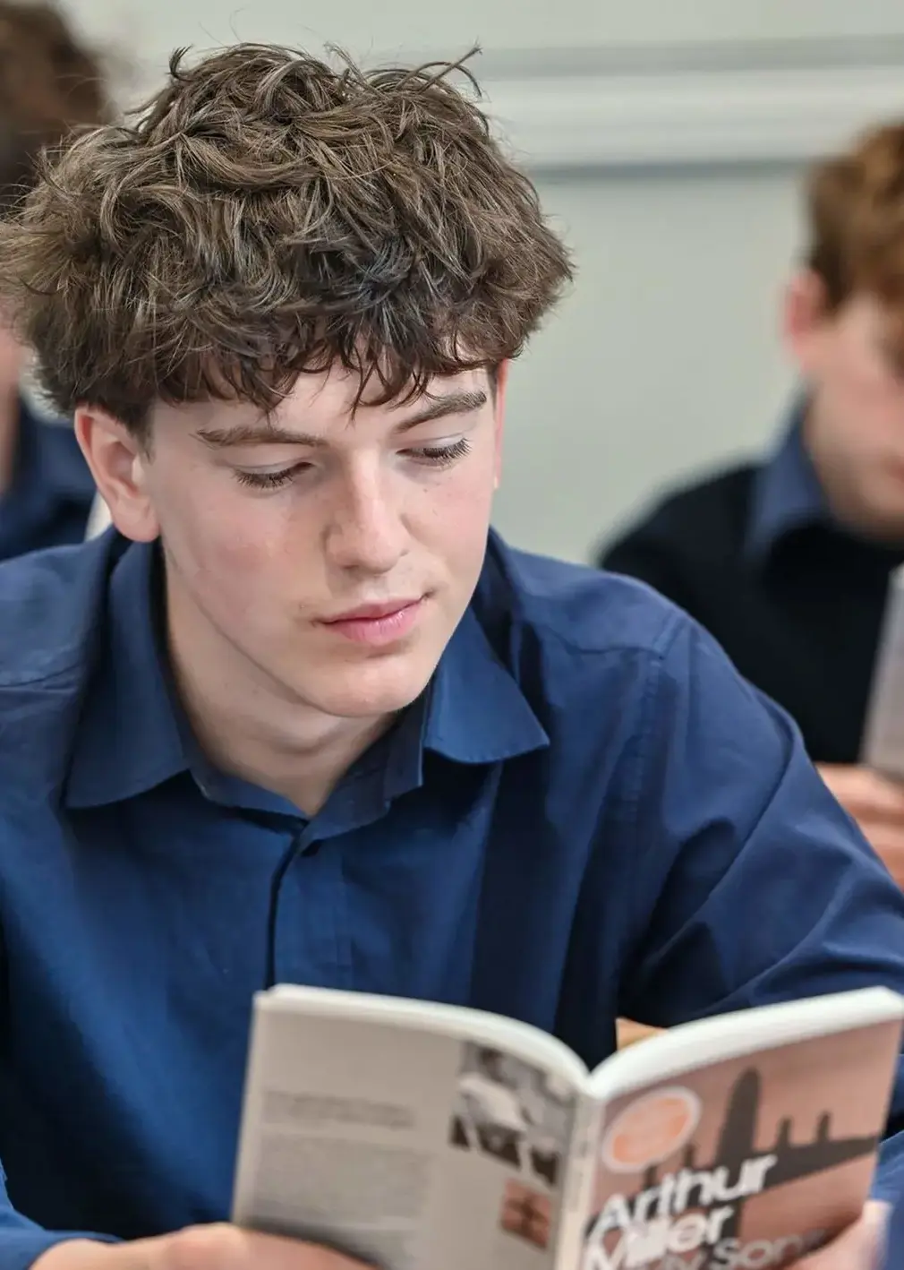 Student Reading in Class