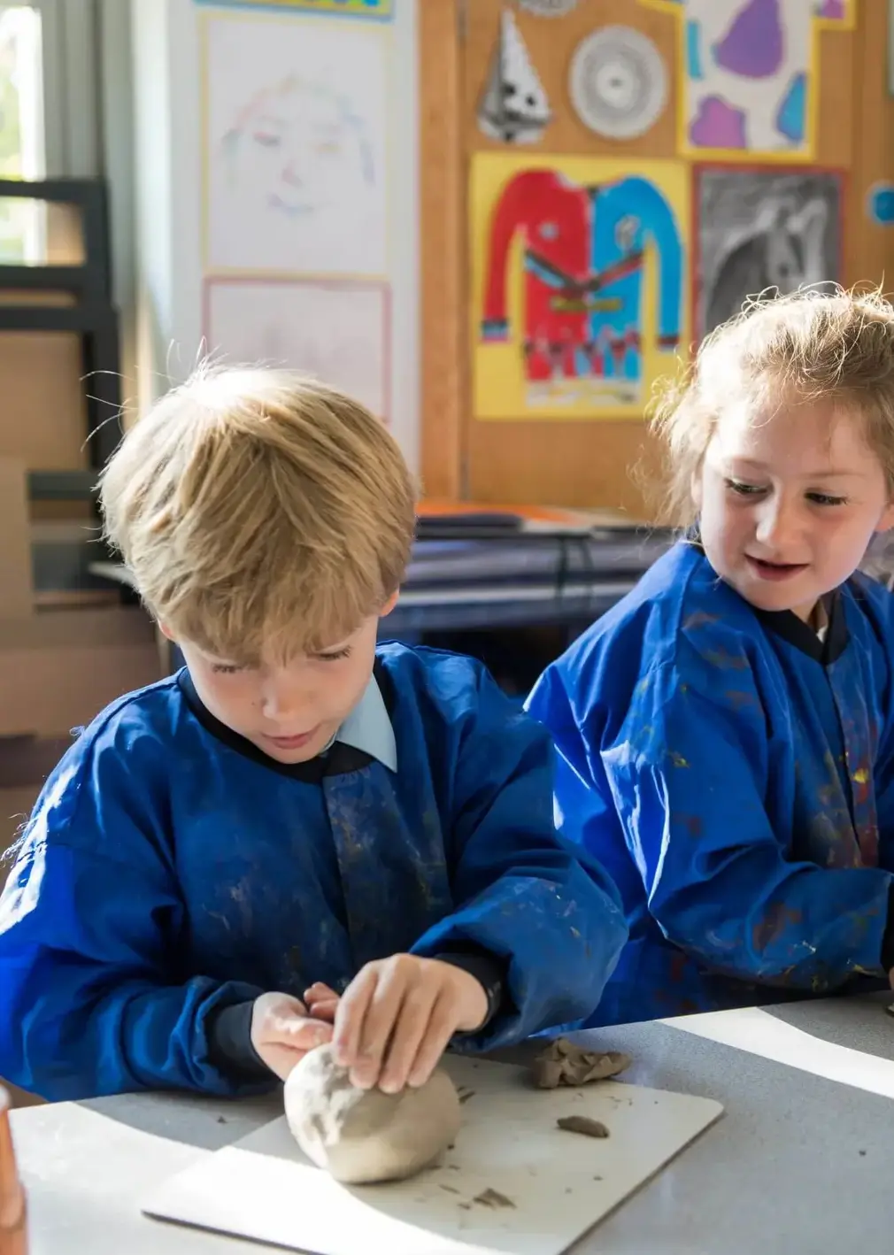 Sherborne Prep students sculpting with clay during an art lesson.