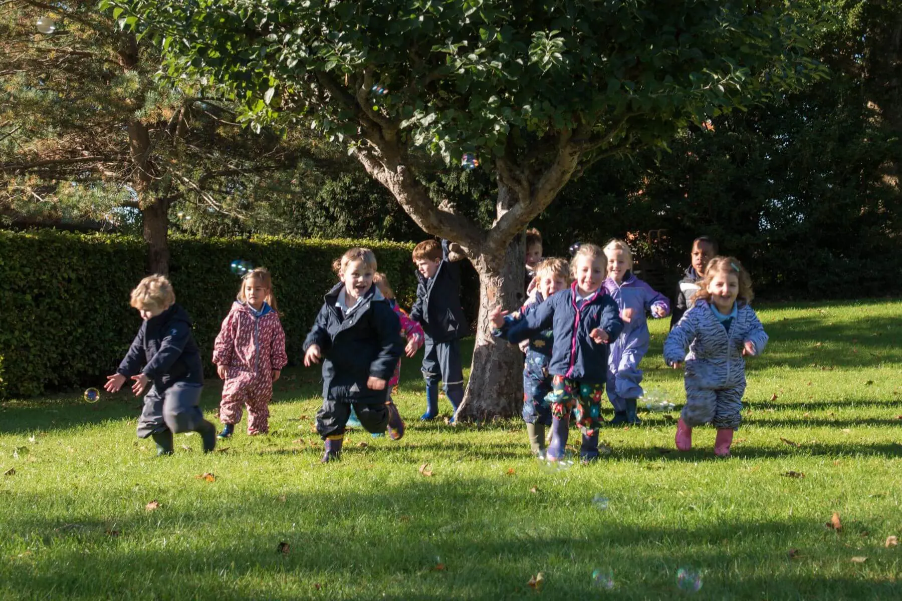 Nursery pupils playing outside.