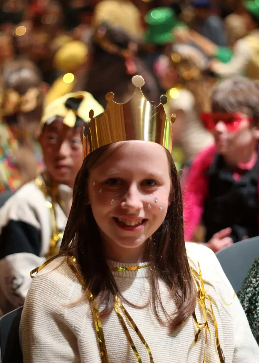 Sherborne Prep student wearing a paper crown.