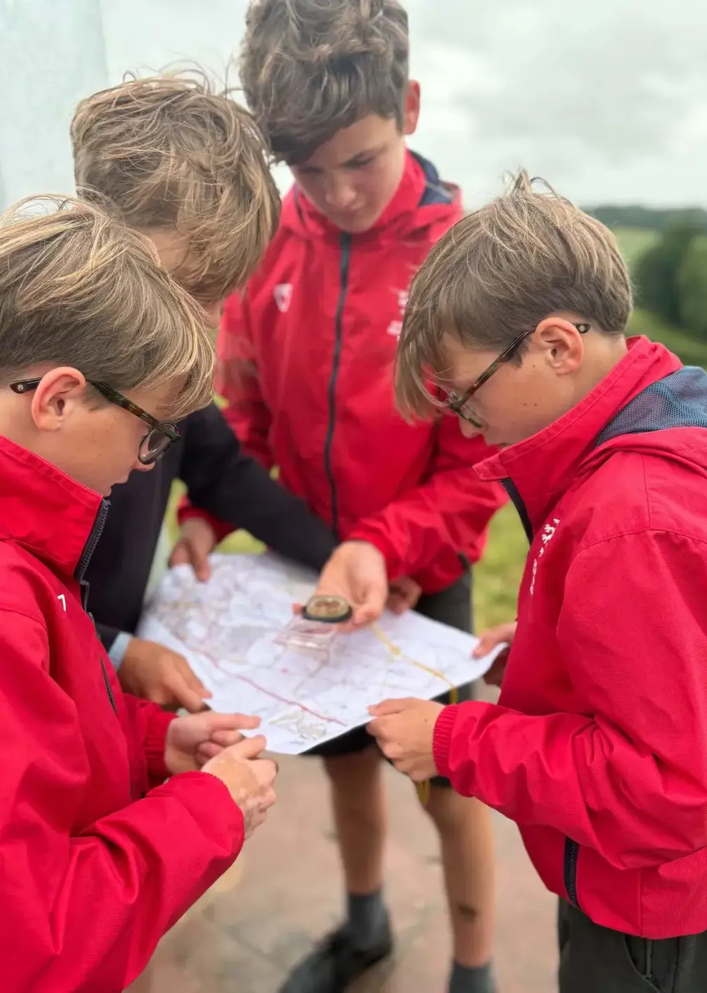 Sherborne Prep students navigating using a map and compass.