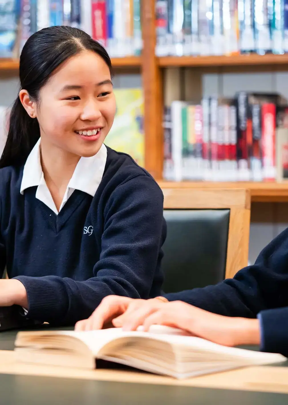 Student in Library with Book