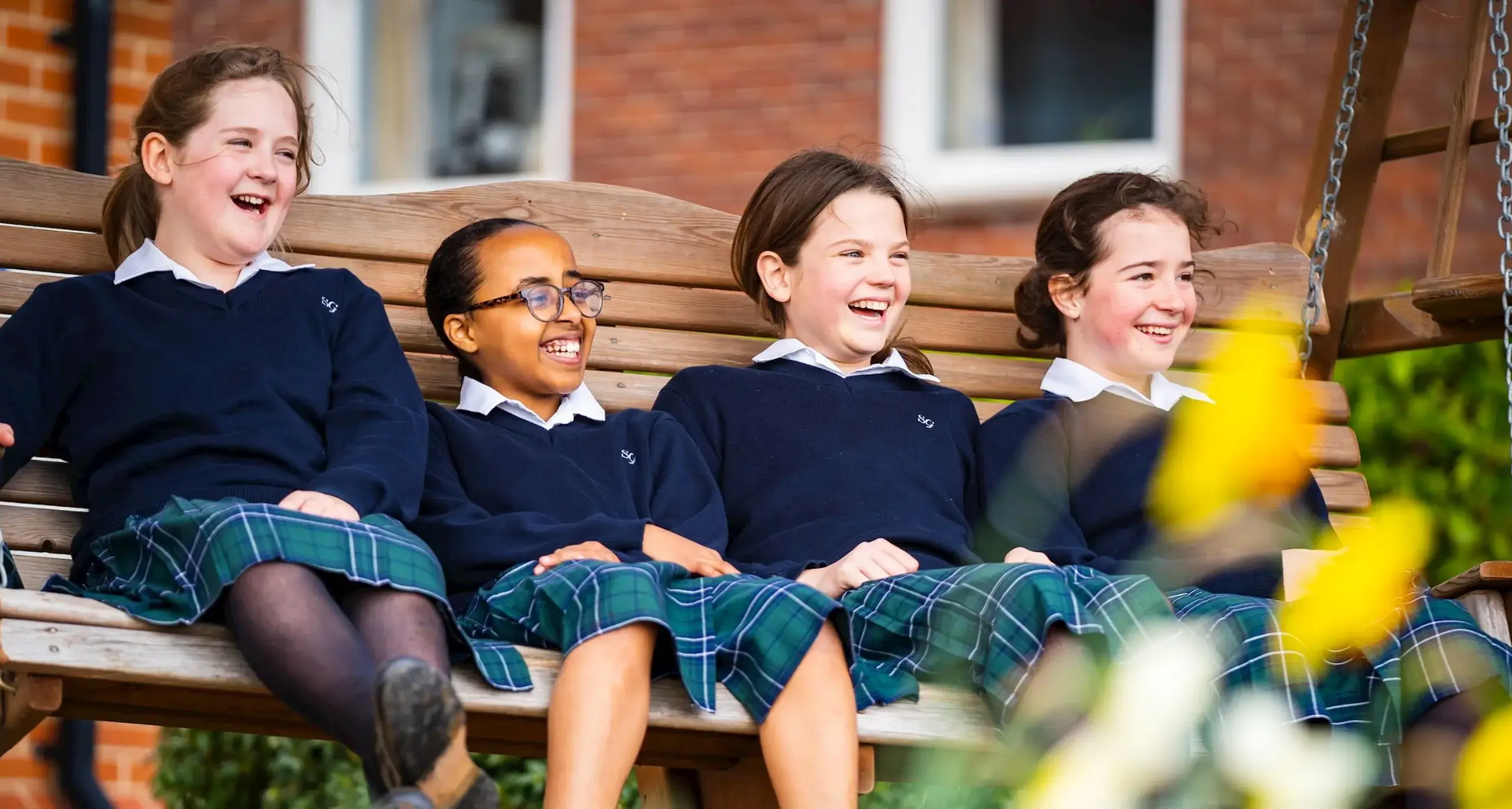 Students on Swing Laughing and Talking