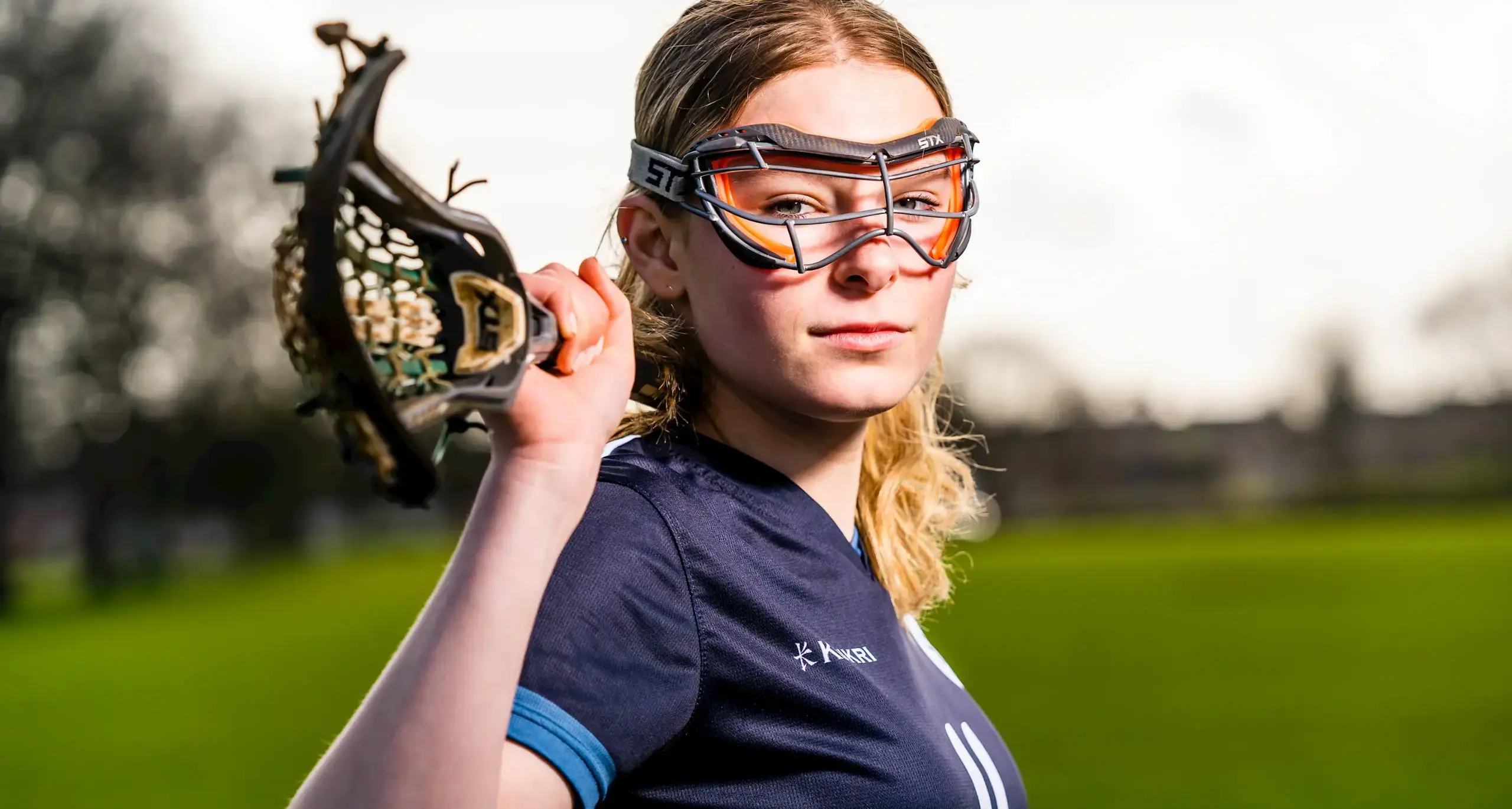 Student Playing Lacrosse