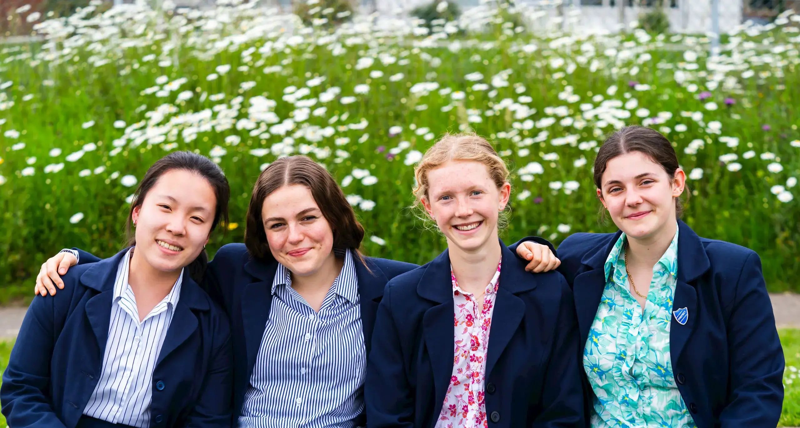 Sixth Form Girls in Garden Smiling