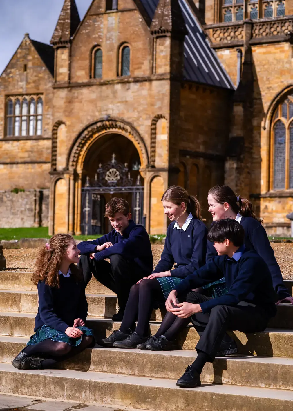 Student Sat on Front Steps of Sherborne Girls Campus