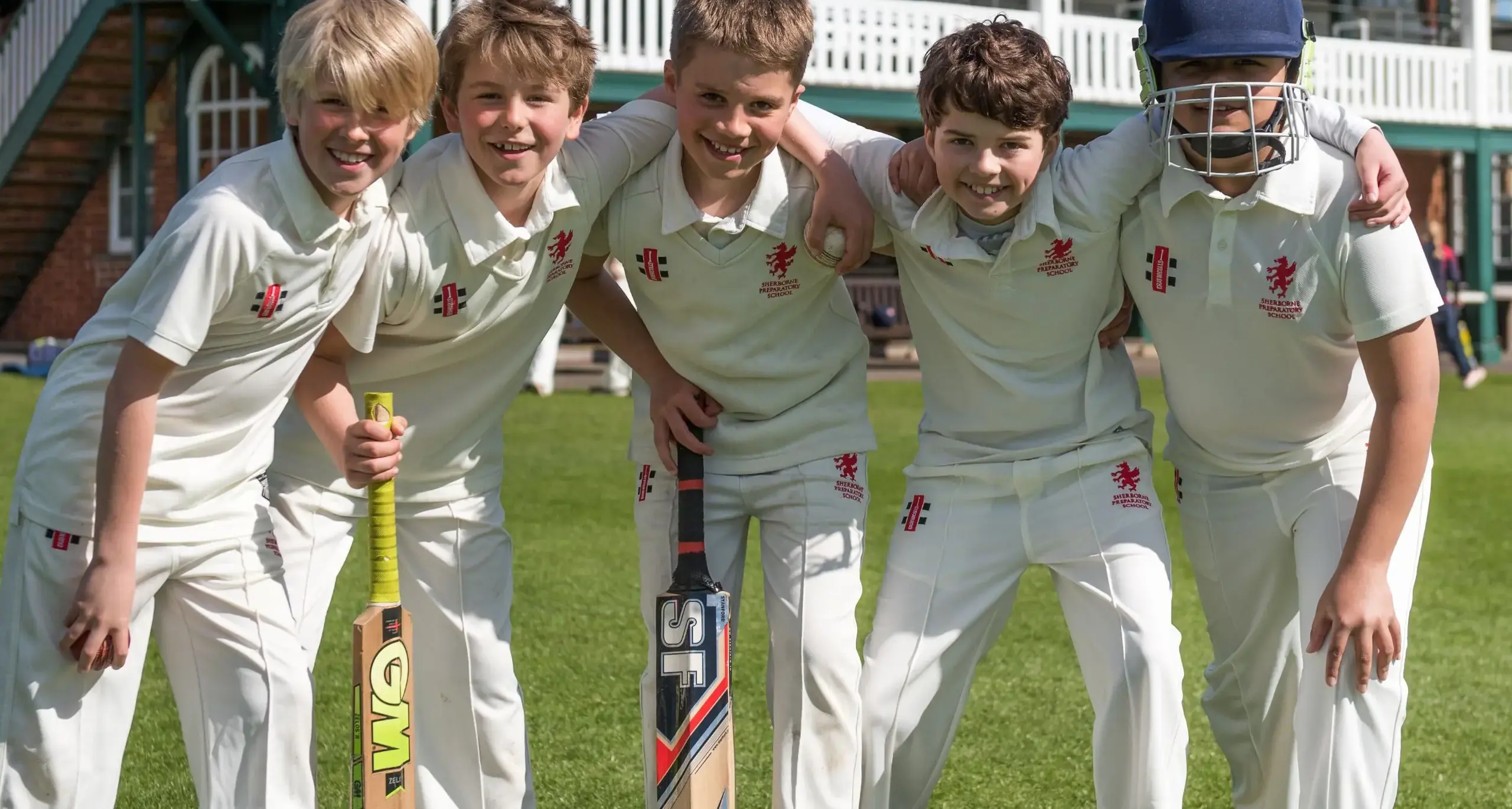 Students in Cricket Unforms on Field