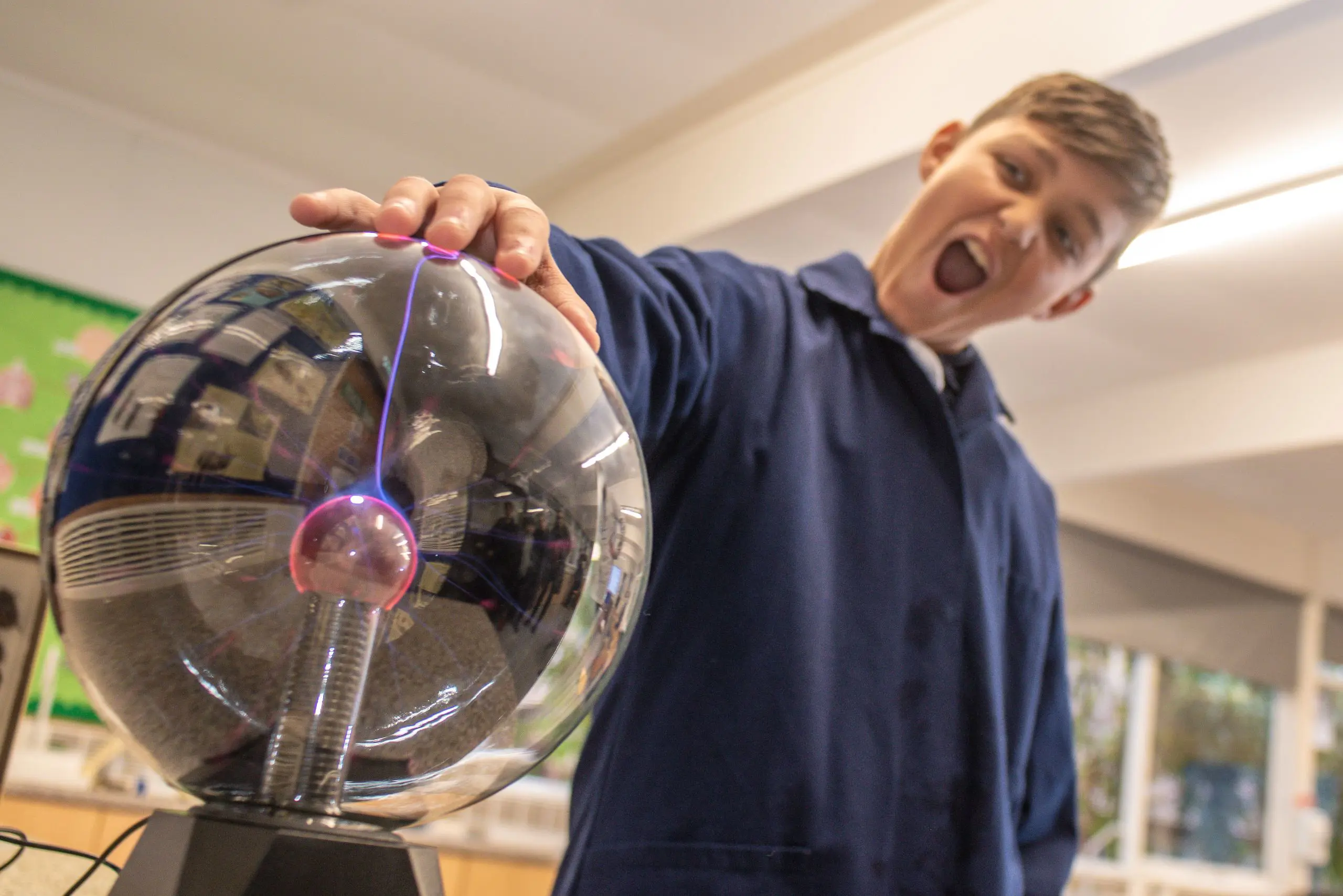 Student Using Plasma Ball