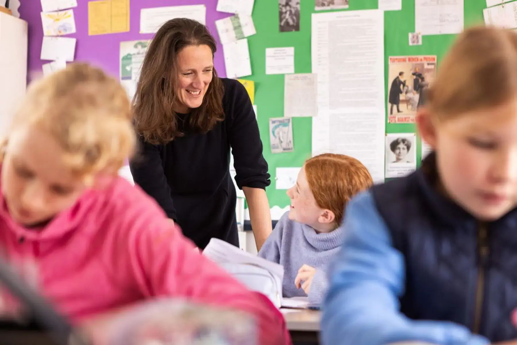 Teacher smiling at a pupil