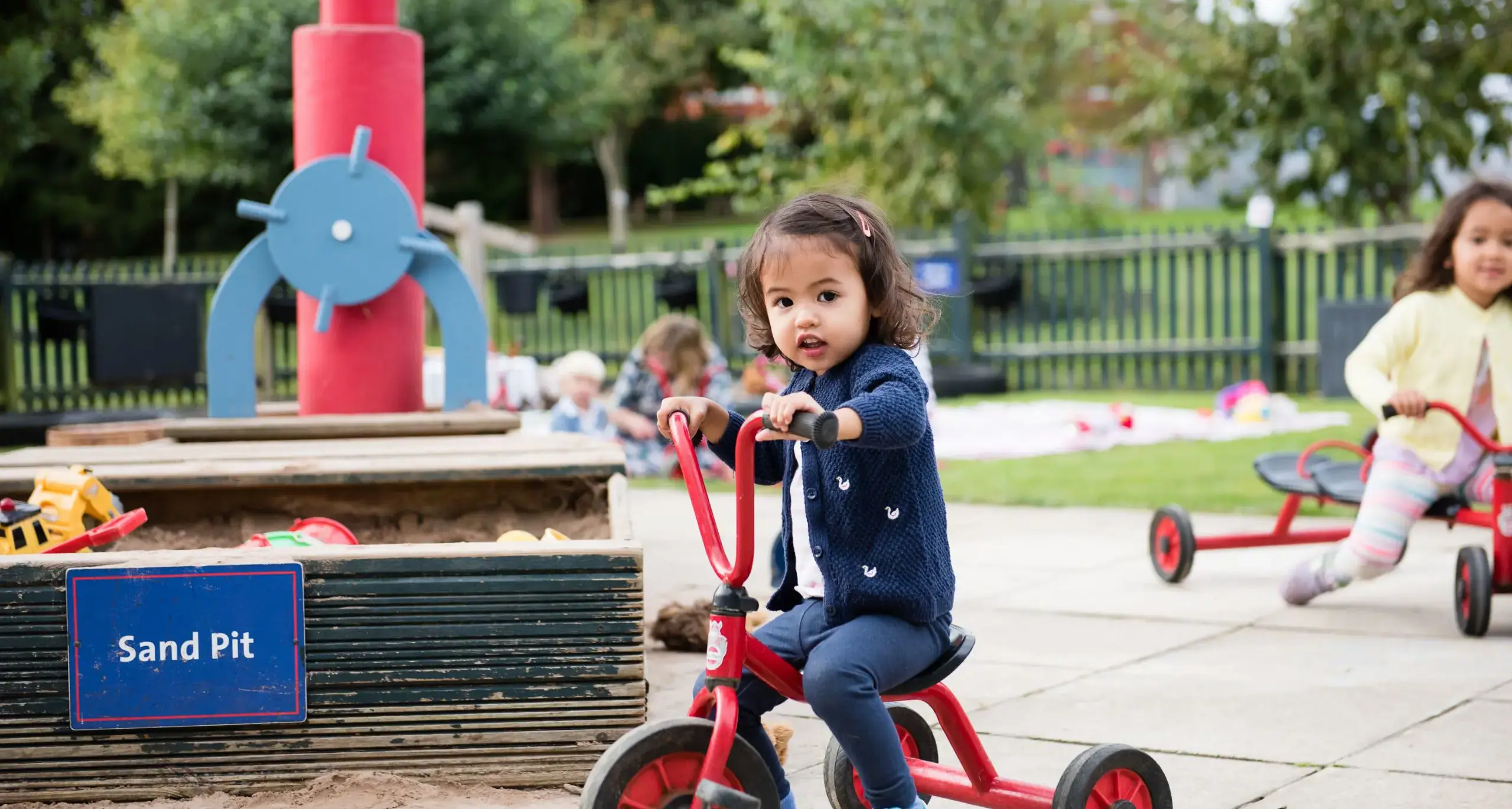 Toddler Student Riding Tricycle