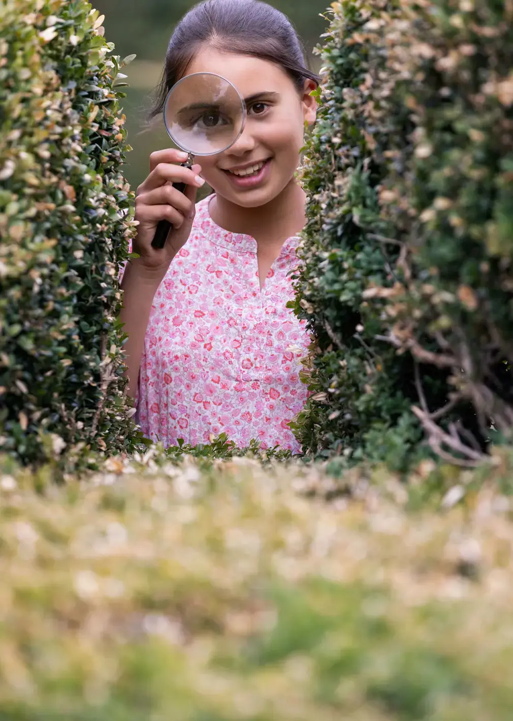 Student Looking Through Magnifying Glass