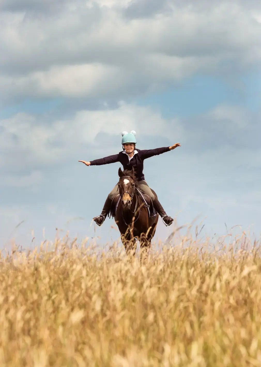 Student Riding Horse in Field