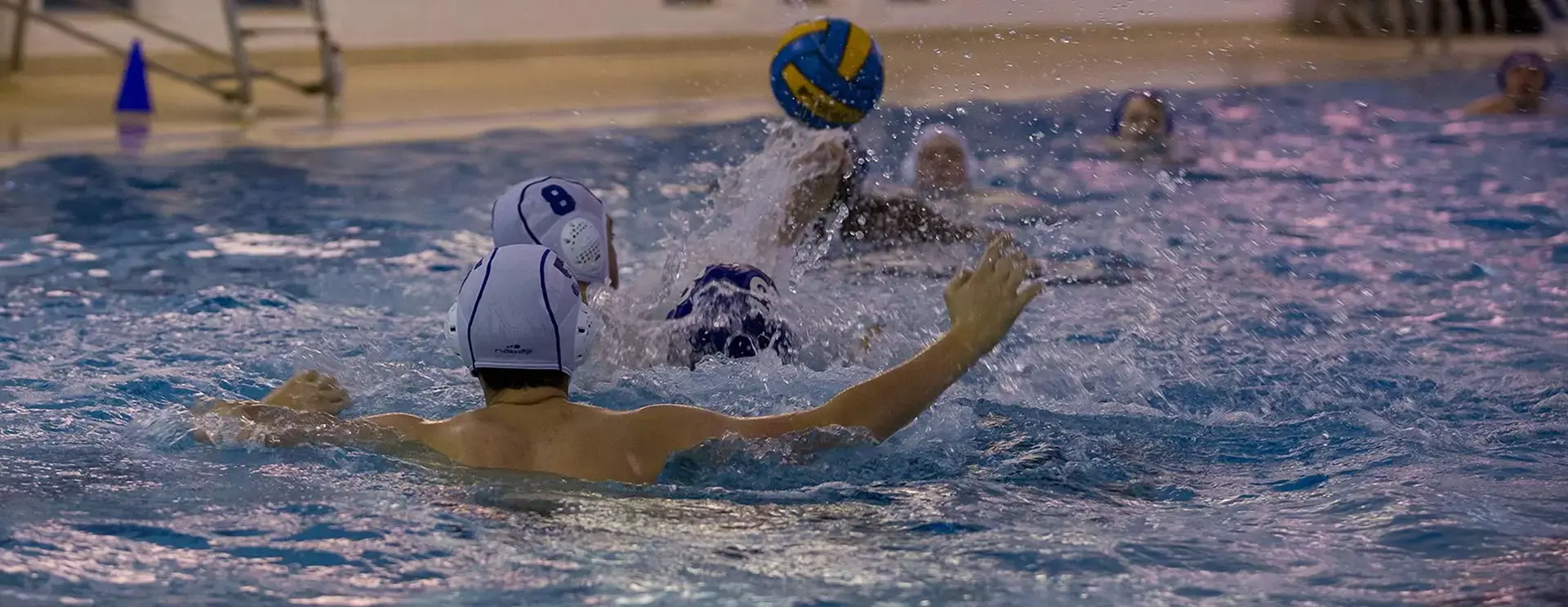 Students Playng Water Polo in Pool