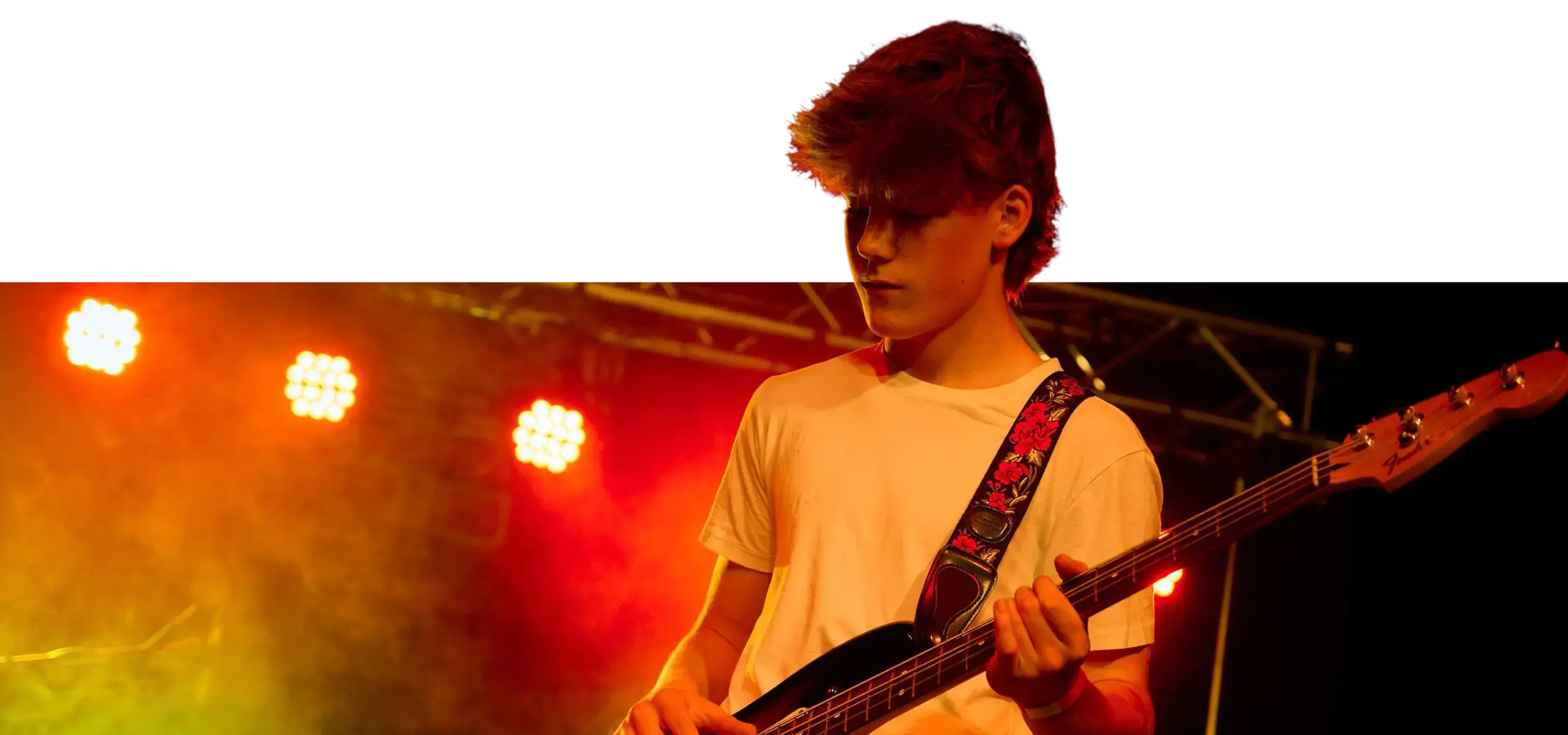 Student Playng Guitar in Concert