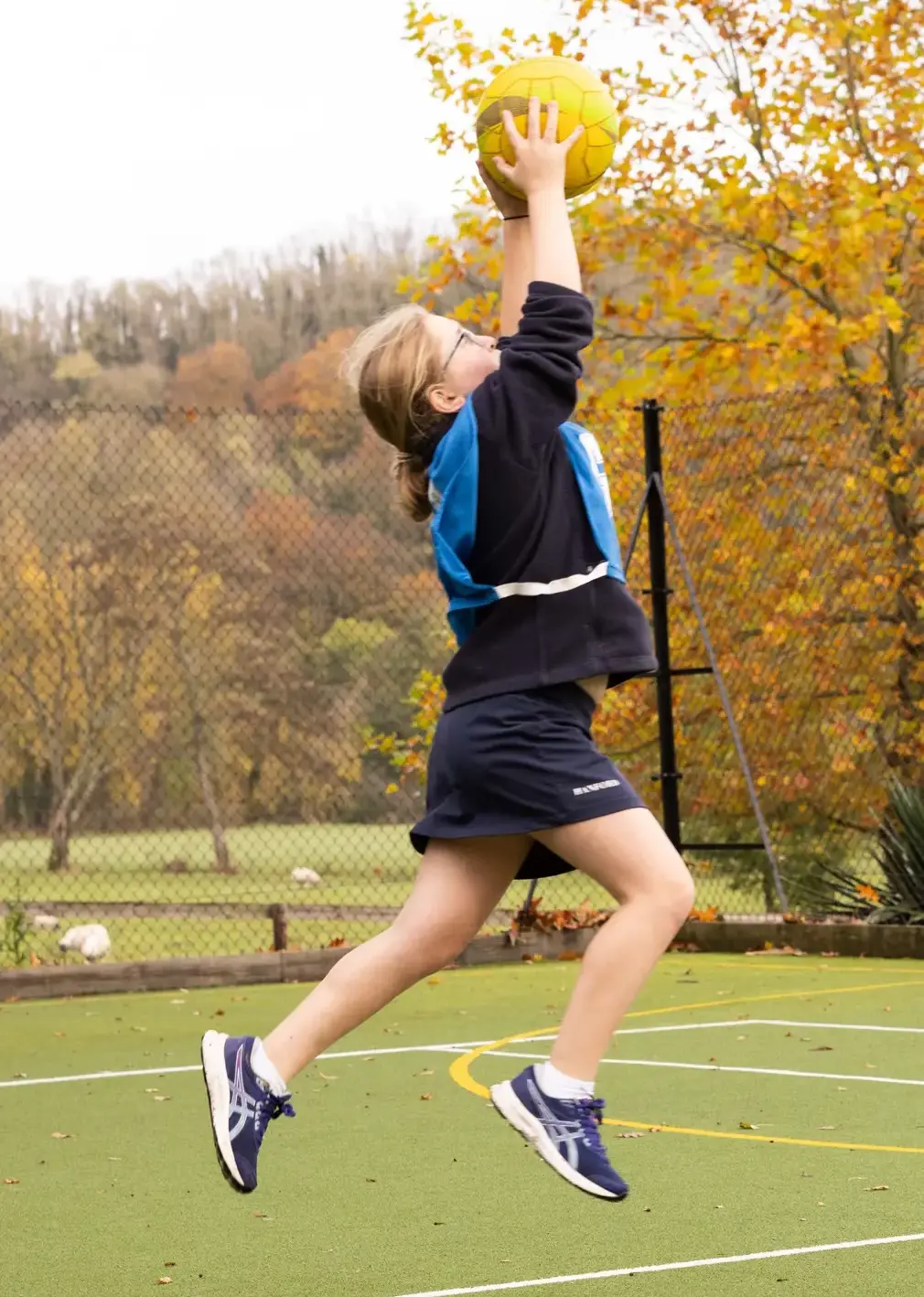 Student Catching Ball Mid-air