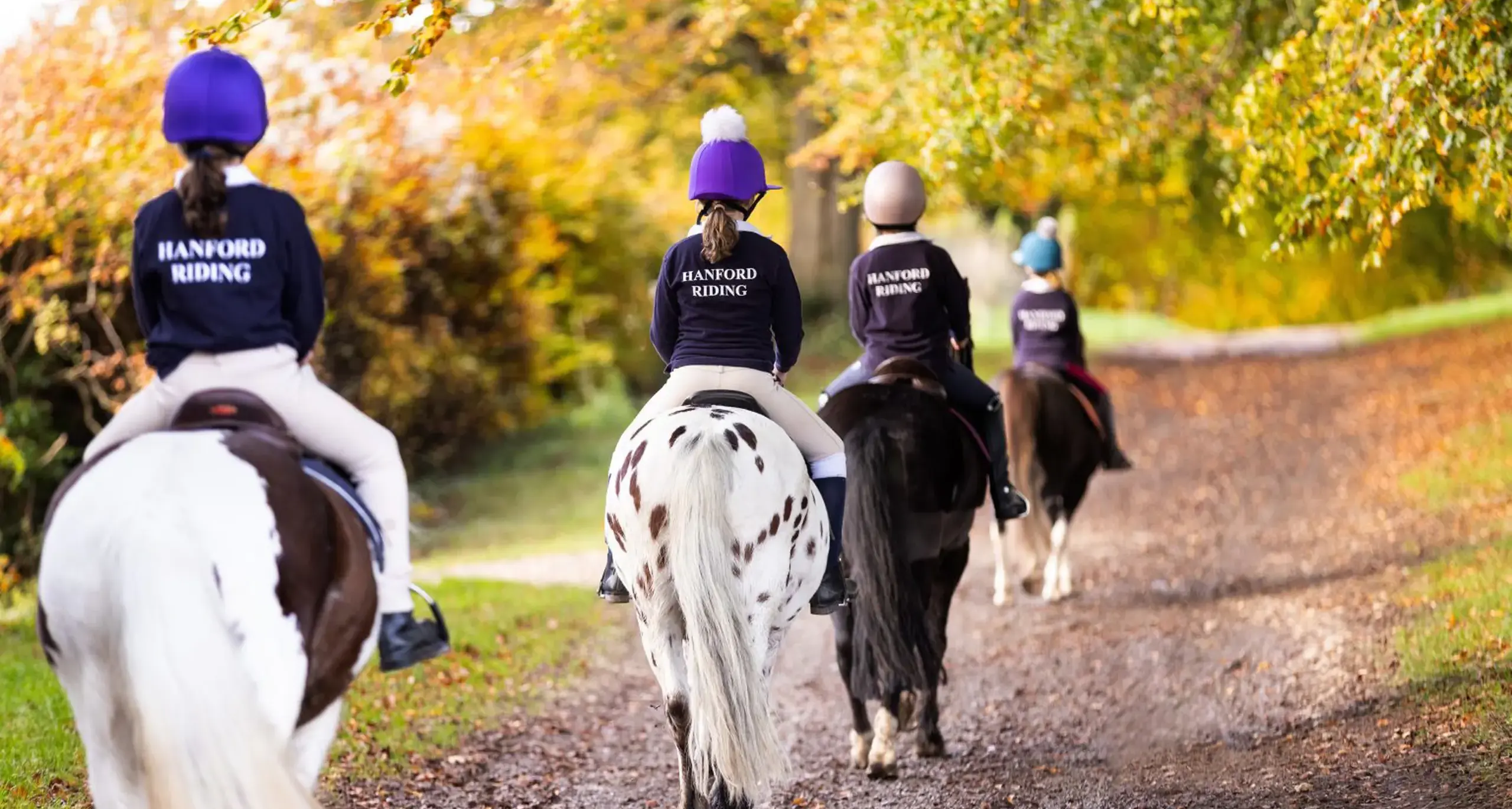 Students Riding Ponies