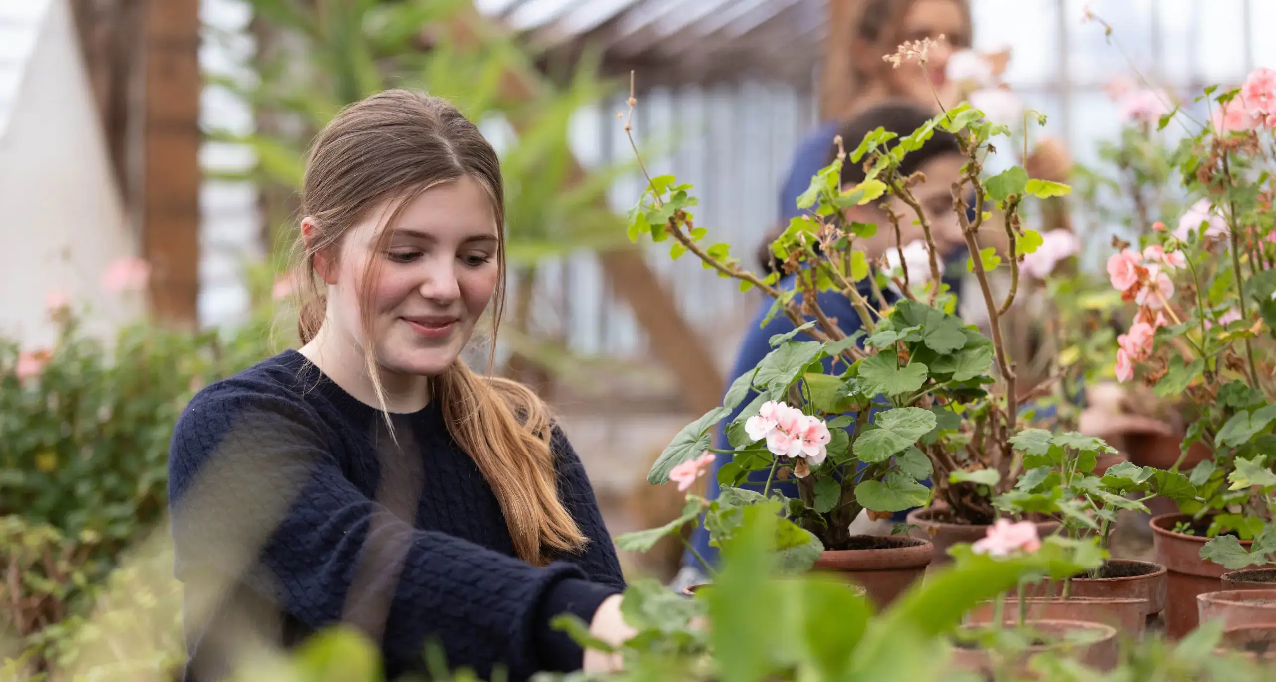 Students Doing Gardening in Green House