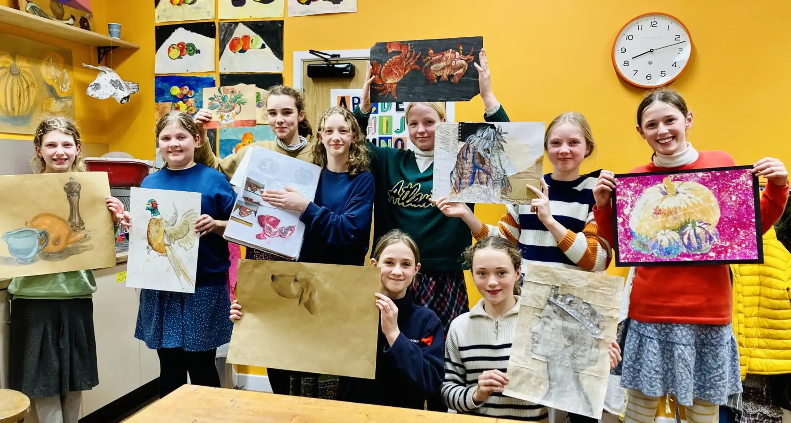 Happy Girls Showing Their Artwork