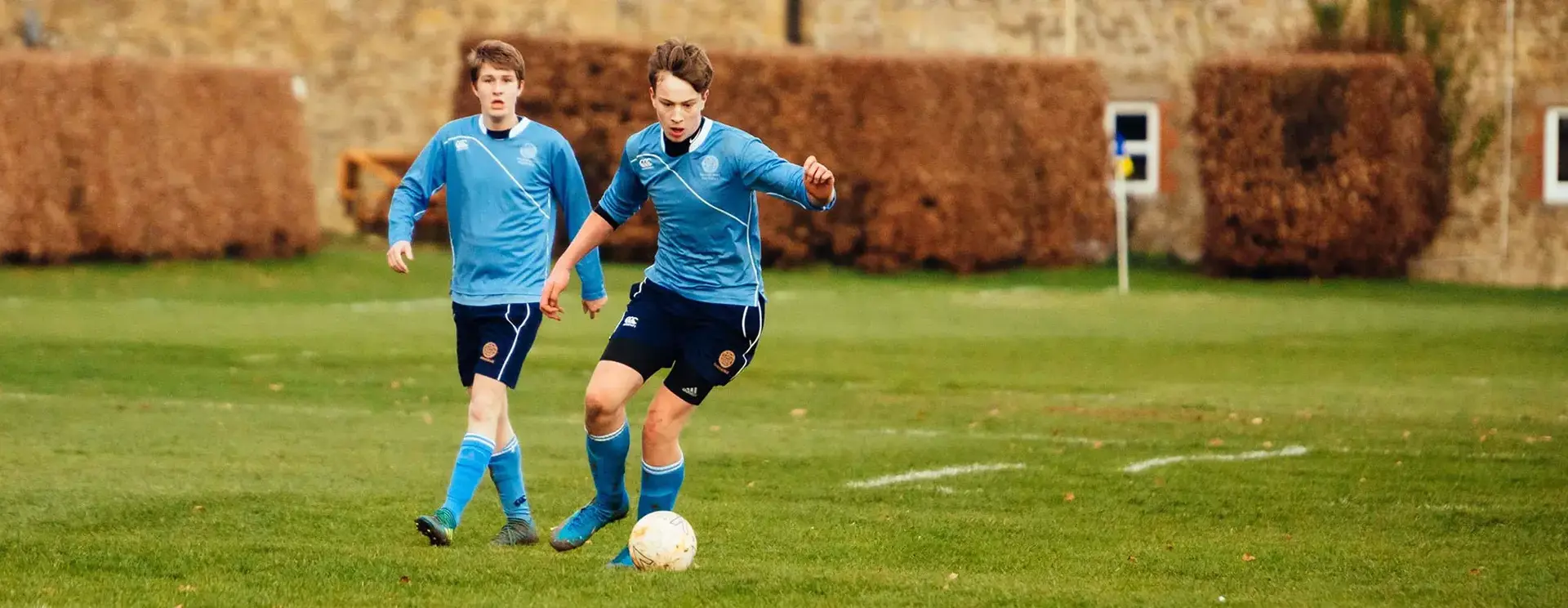 Students Playing Football