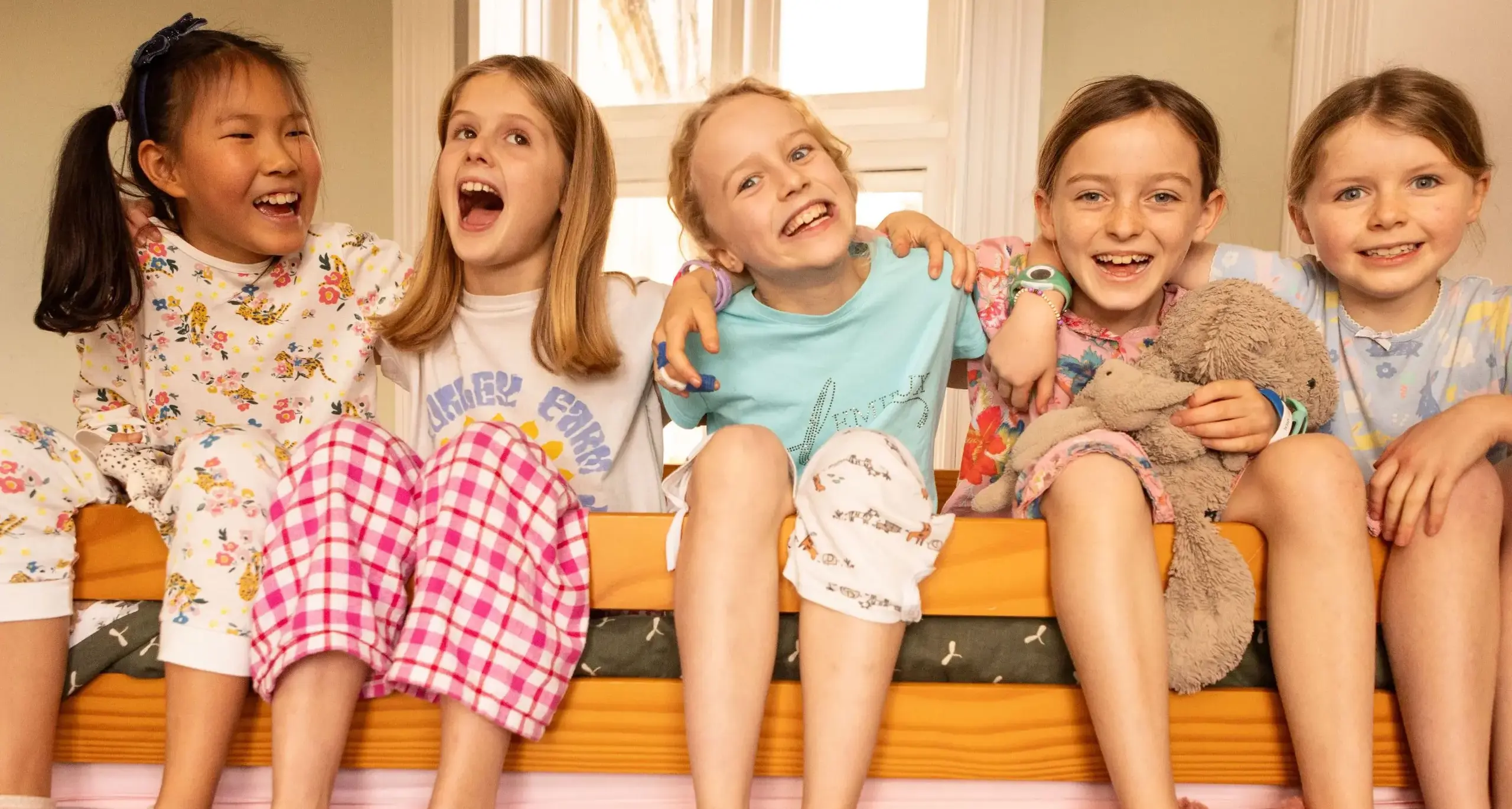 Students in Bunk Bed Laughing and Smiling together