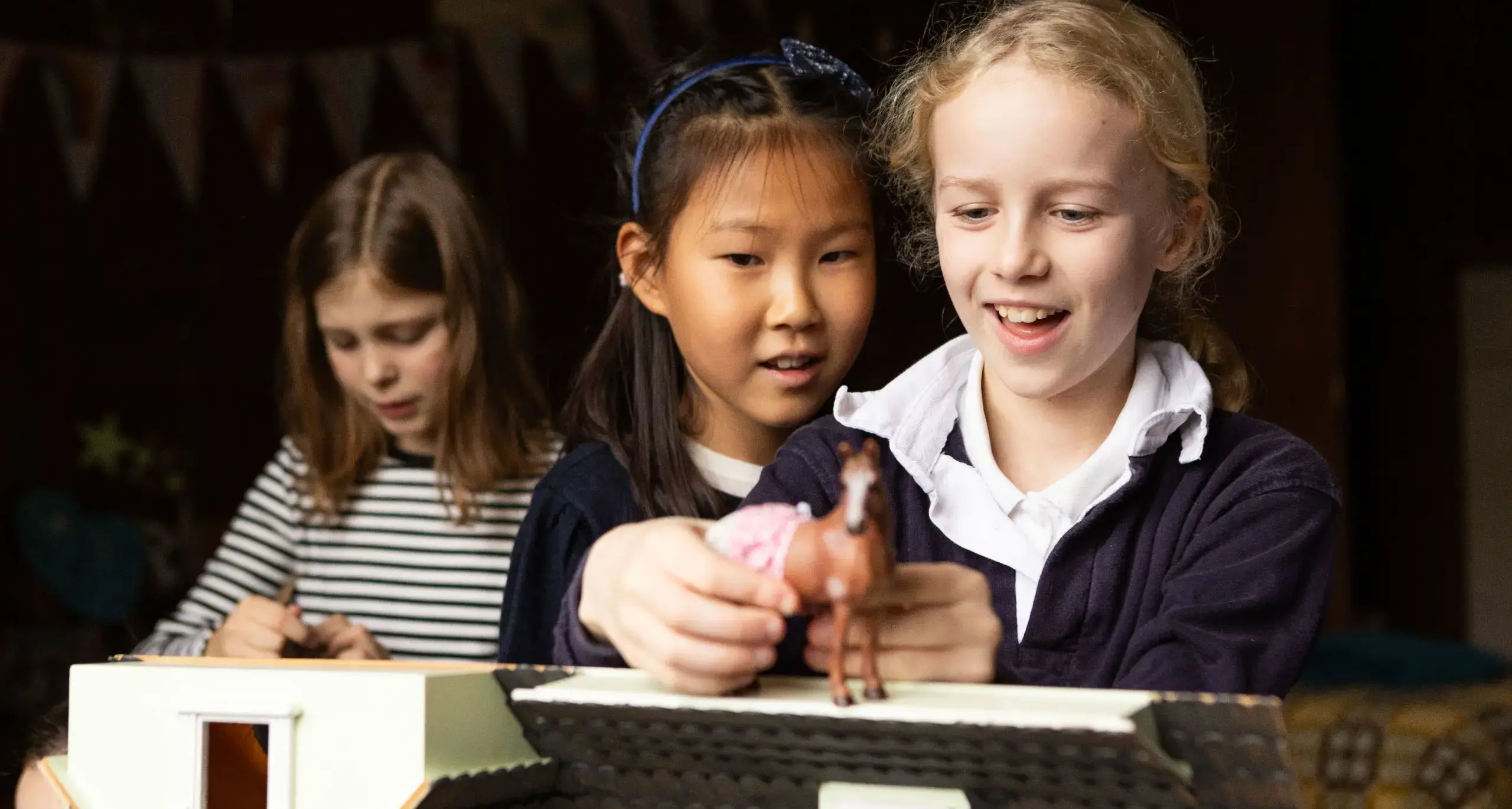 Students Playing with Horses in their Dorm