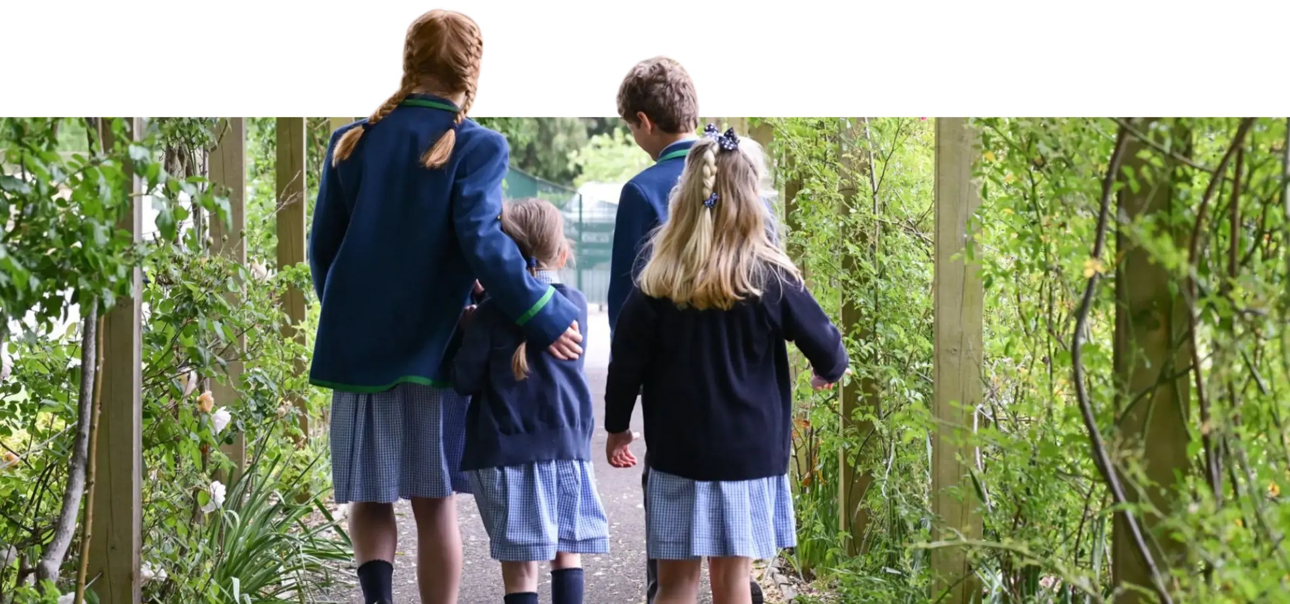 Students Walking Through Wooded Area on Sherborne Campus gardens