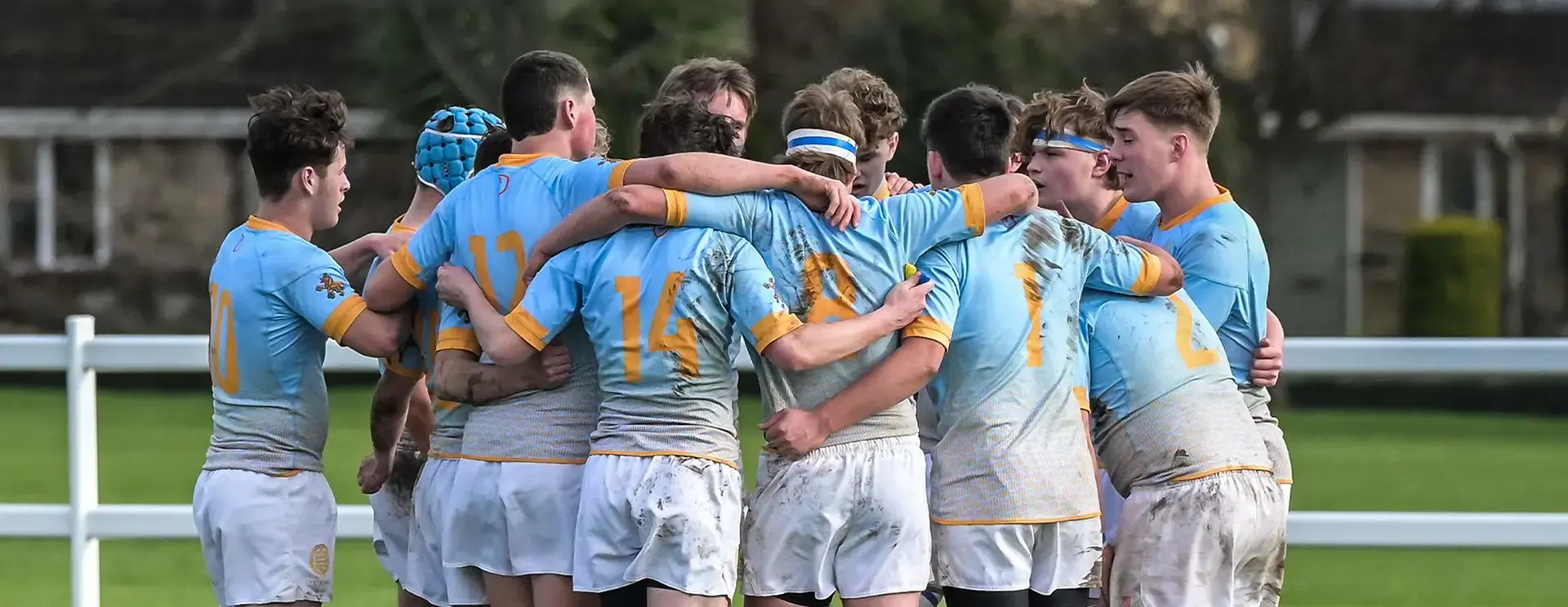 Students Huddling Before Rugby Match