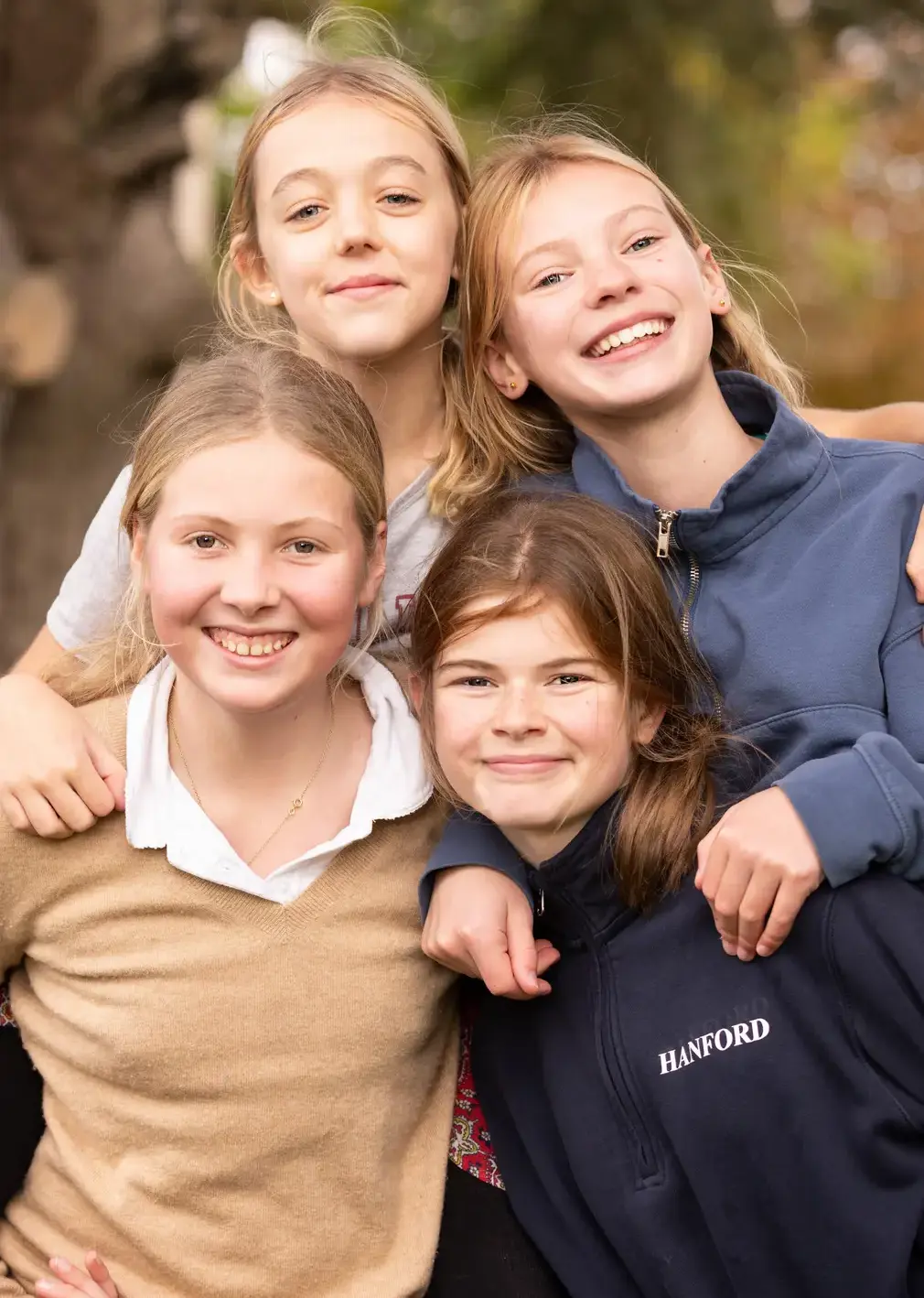 Students Smiling and Piggy Backing Each Other